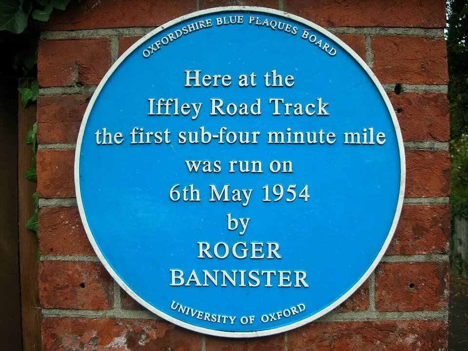 Blue plaque at the Iffley Road running track in Oxford marking the first four-minute mile