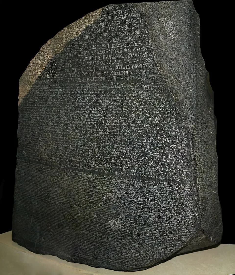 Photograph of the Rosetta Stone showing its three bands of inscribed text