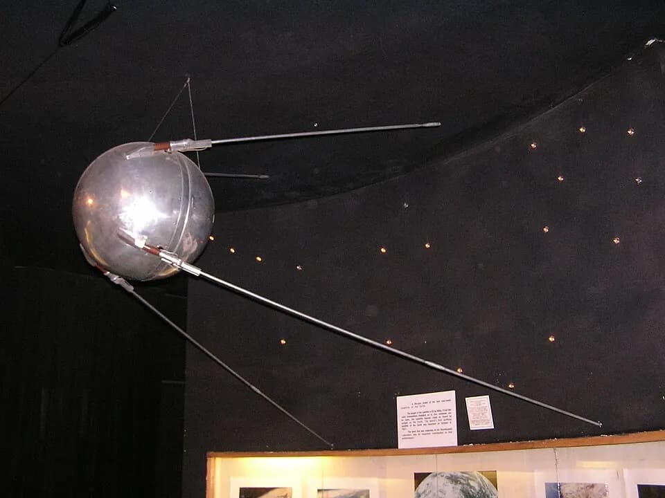 Illustration of Sputnik 1, the first artificial satellite, orbiting Earth